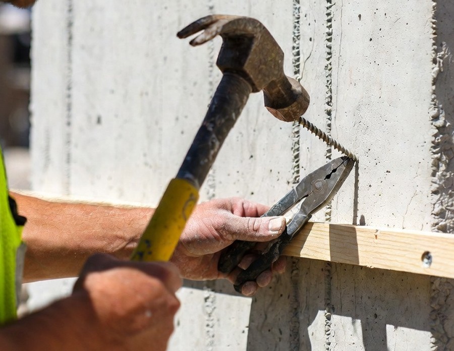 hammer a nail into concrete