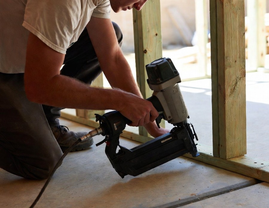 nailing wood to concrete with a pneumatic nail gun
