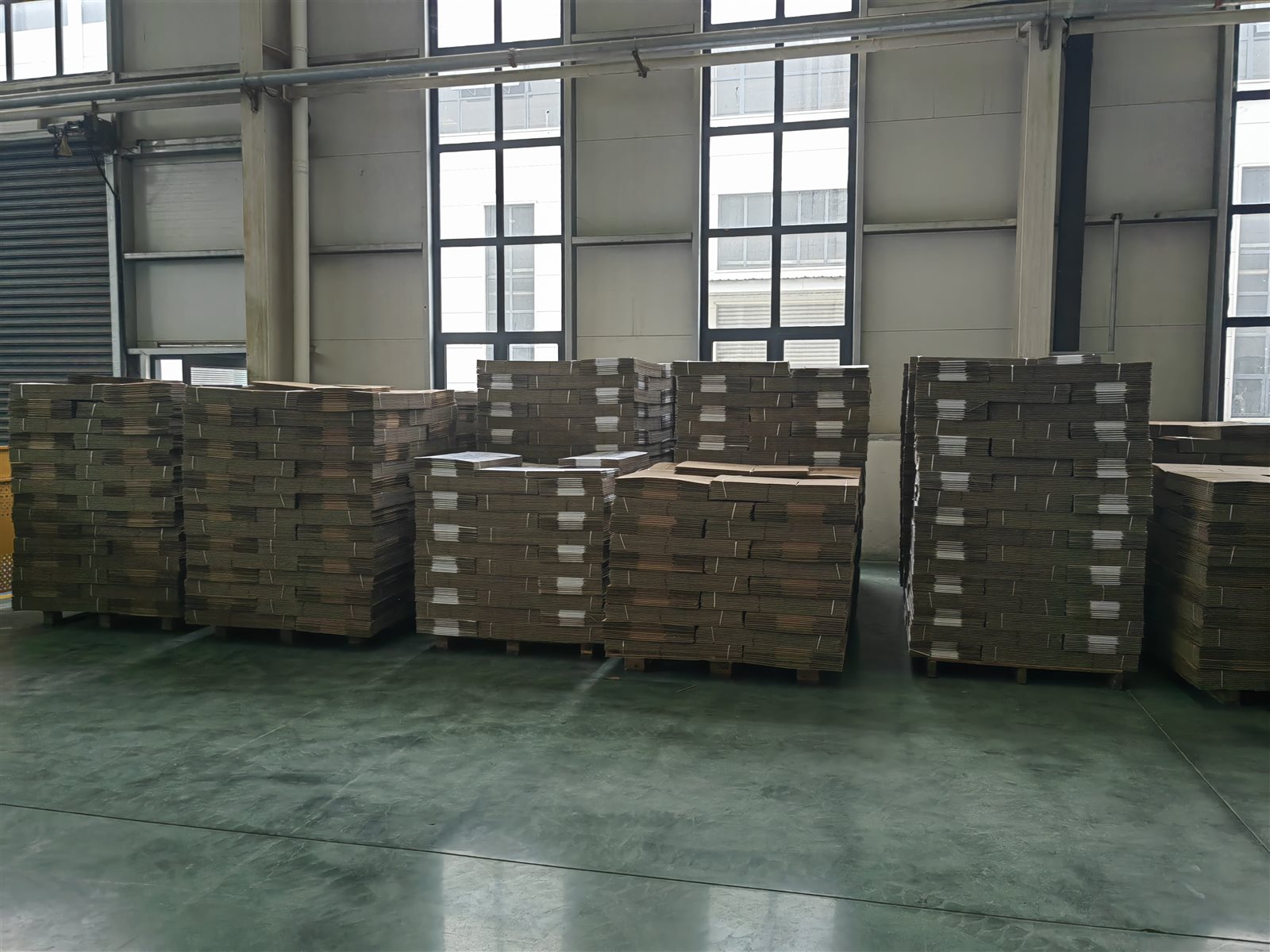 Custom cartons prepared for the finished coils — stored flat and ready for packing and shipment