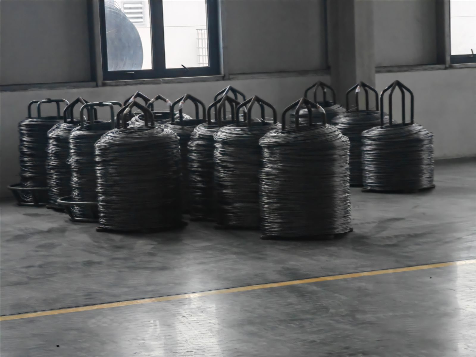Coils of high-grade steel wire, inspected and stored before entering production